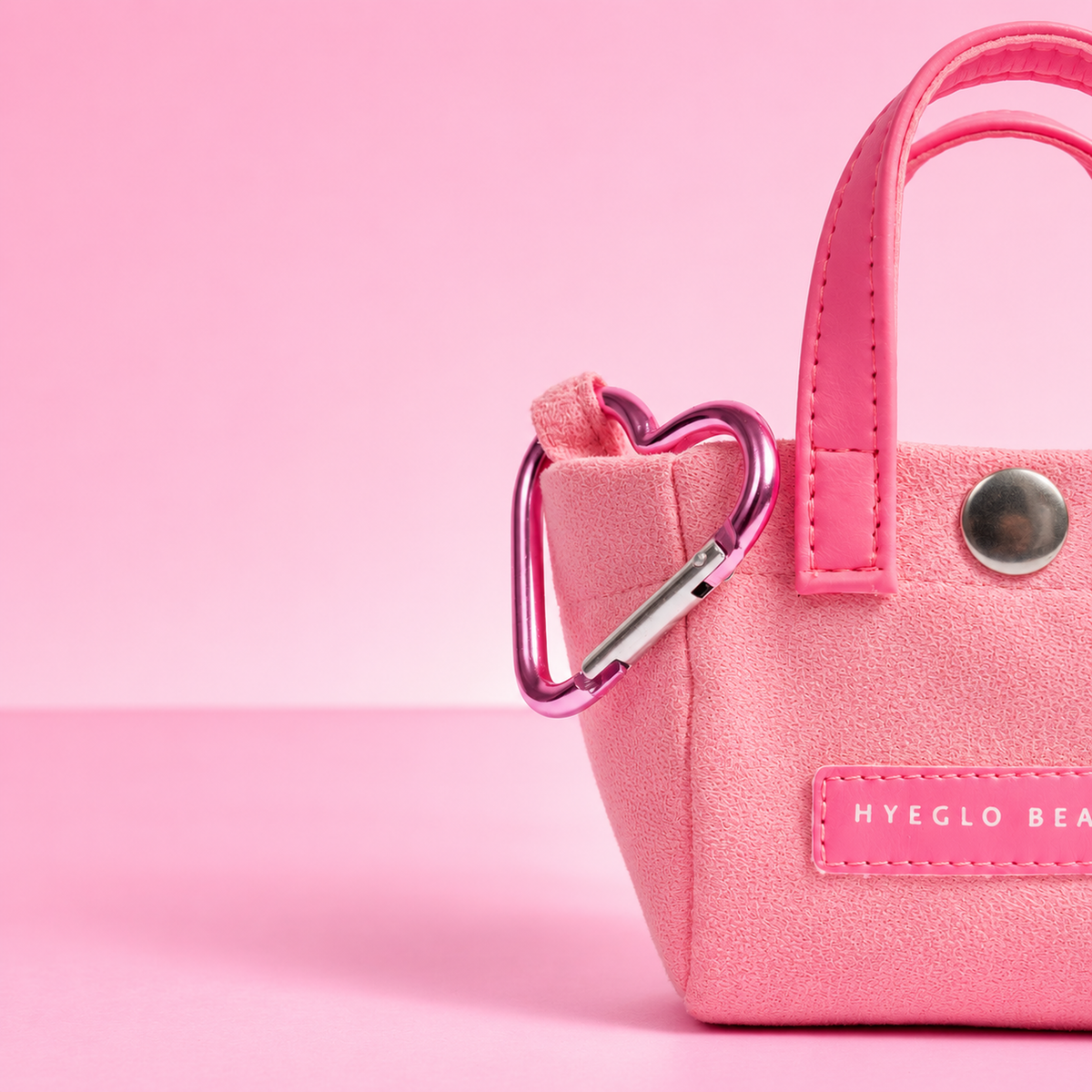 Pink Mini Charm Bag with a heart carabiner